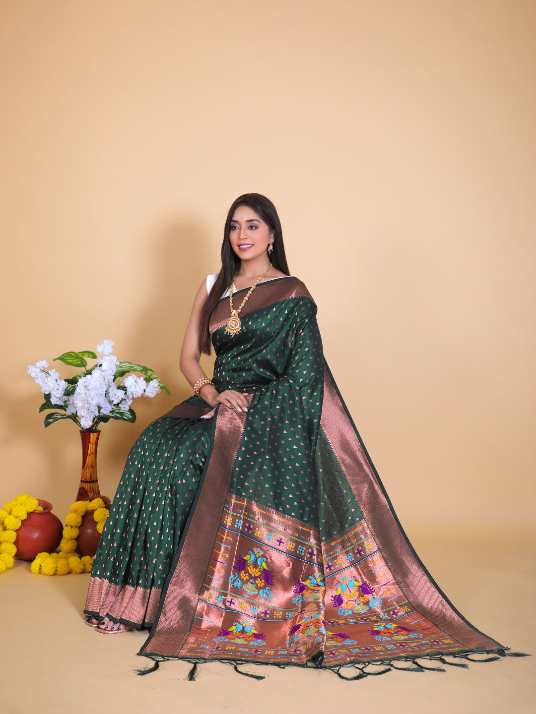 Bottle green color paithani silk saree with zari weaving work
