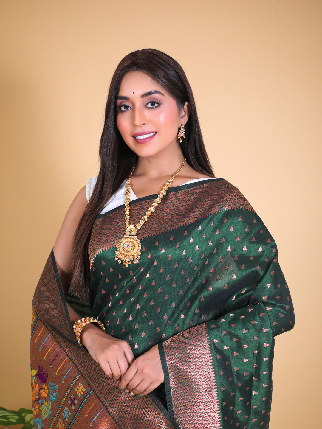 Bottle green color paithani silk saree with zari weaving work