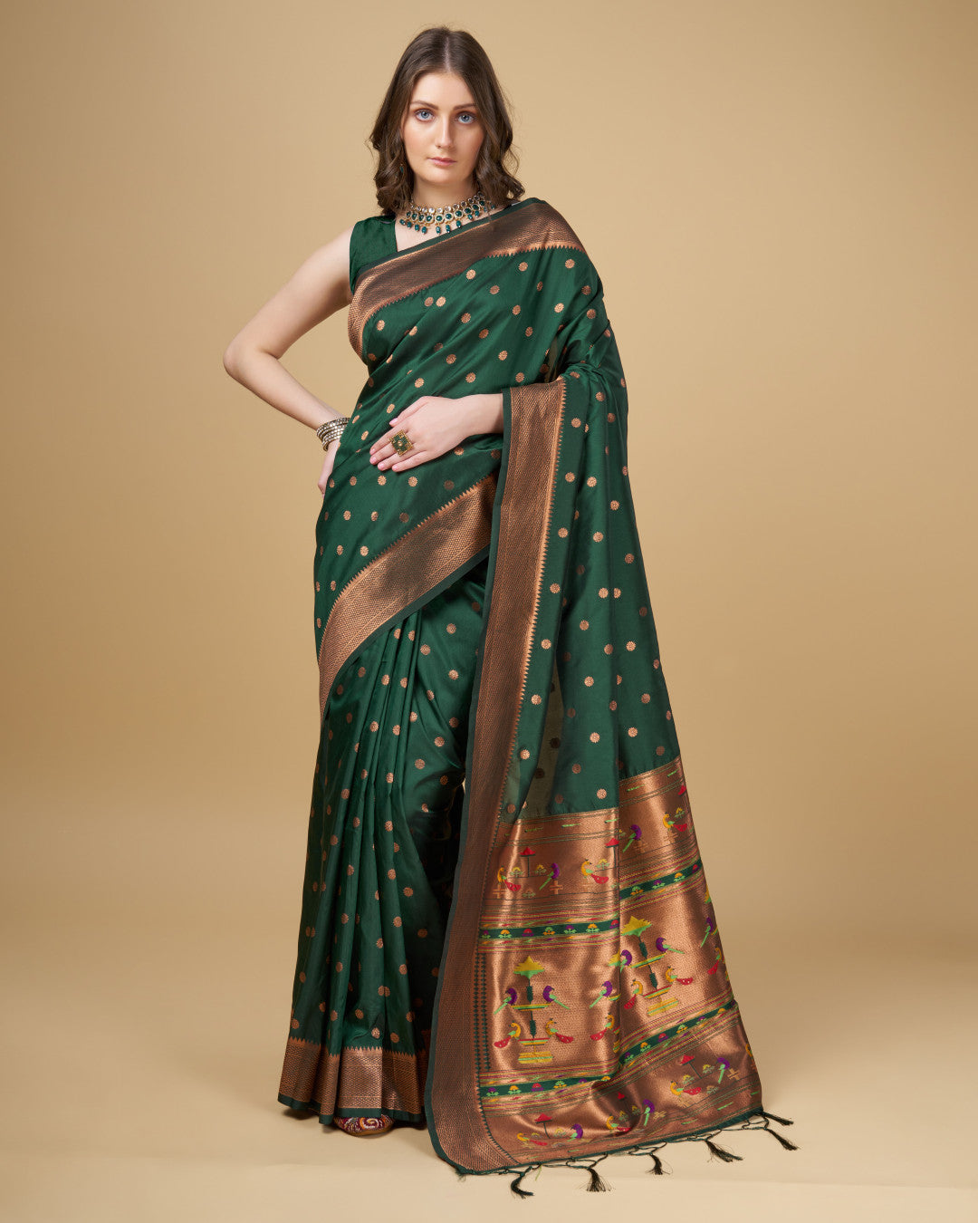 Dark green color paithani silk saree with copper zari weaving work