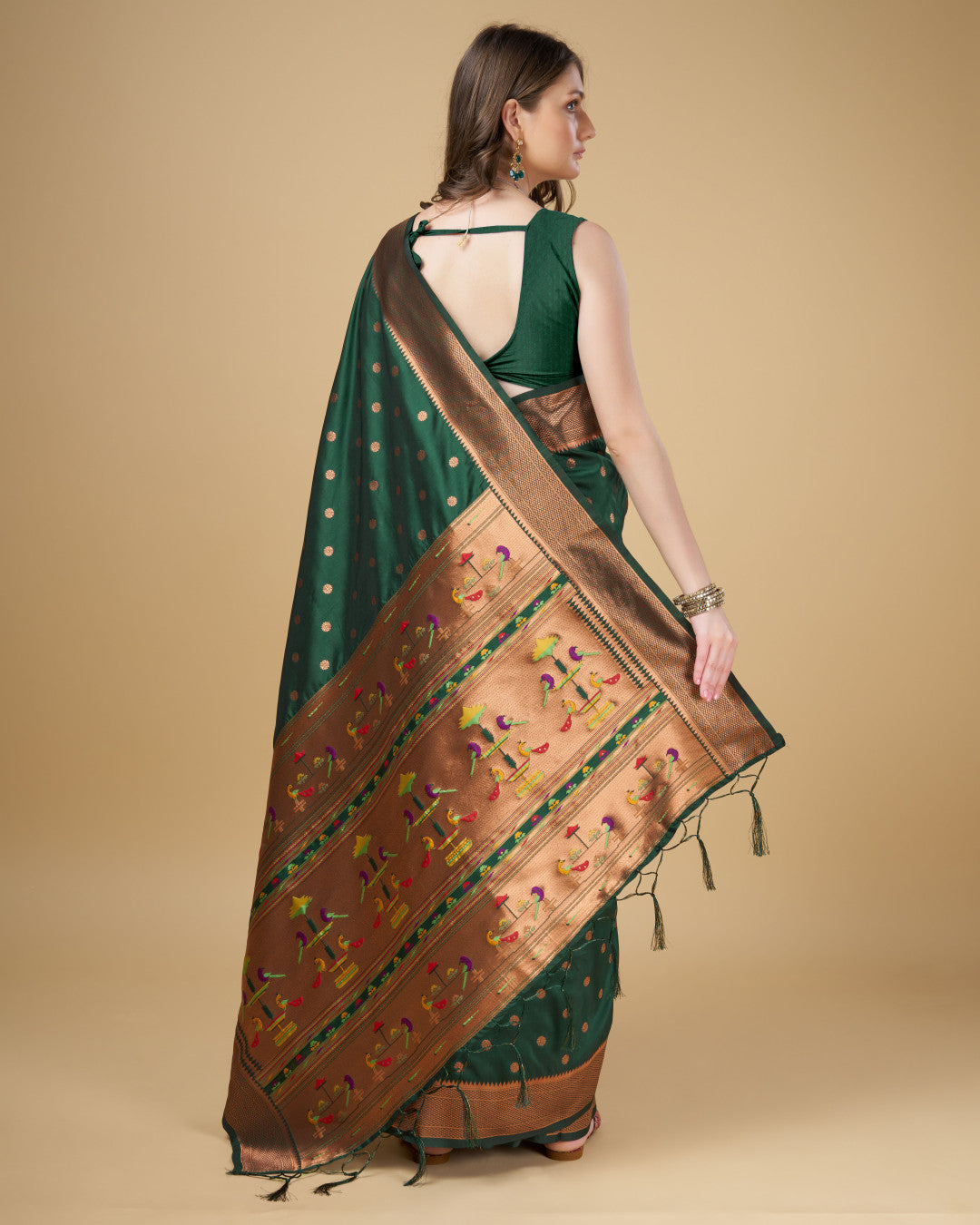 Dark green color paithani silk saree with copper zari weaving work