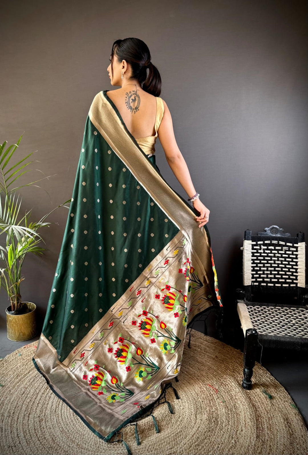 Dark green traditional paithani silk saree with zari weaving work