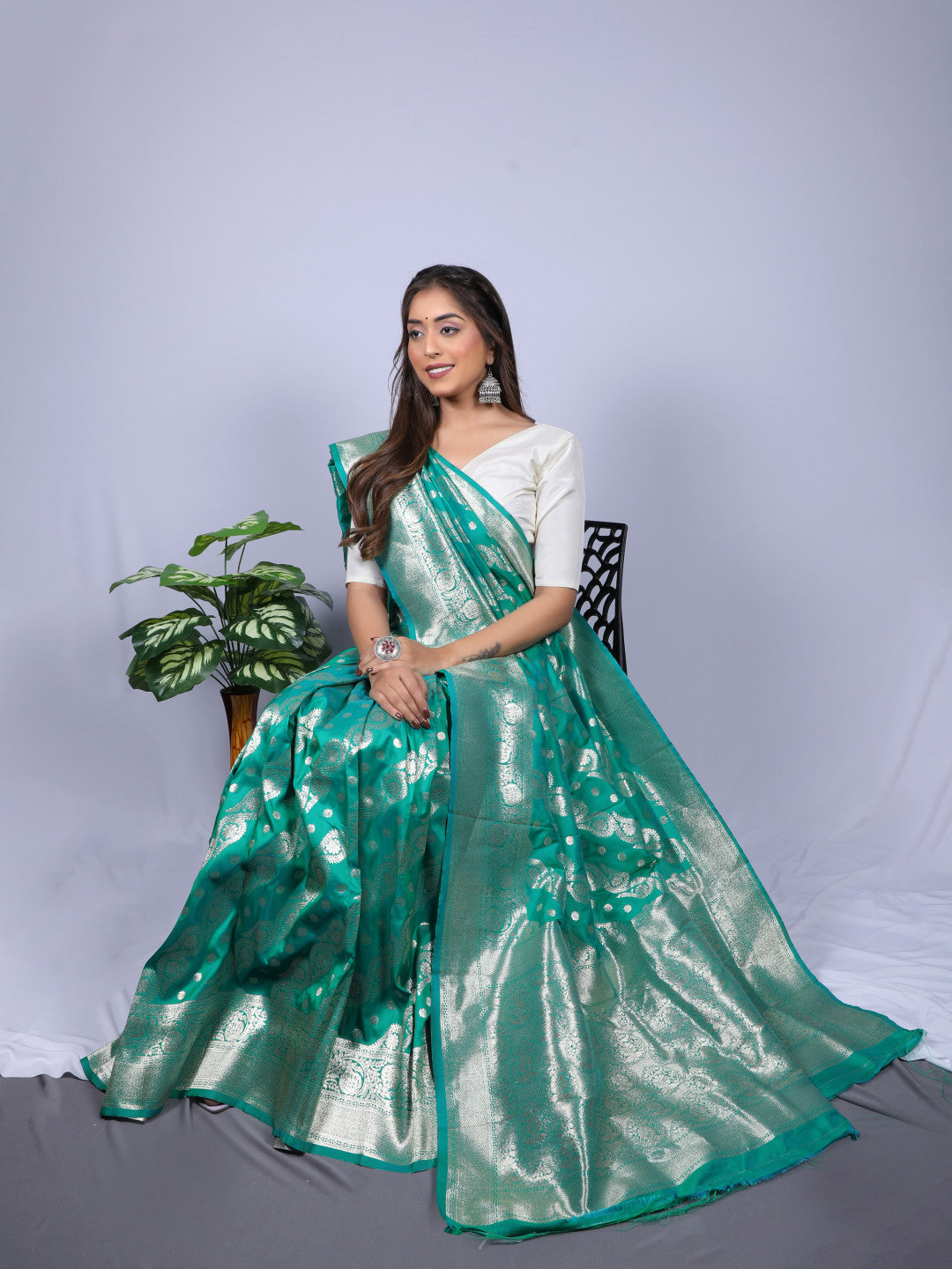 Green color banarasi silk saree with zari weaving work