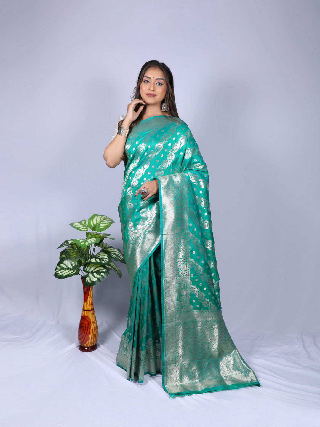 Green color banarasi silk saree with zari weaving work