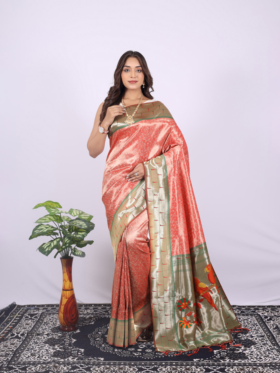 Orange color tissue silk saree with zari weaving work