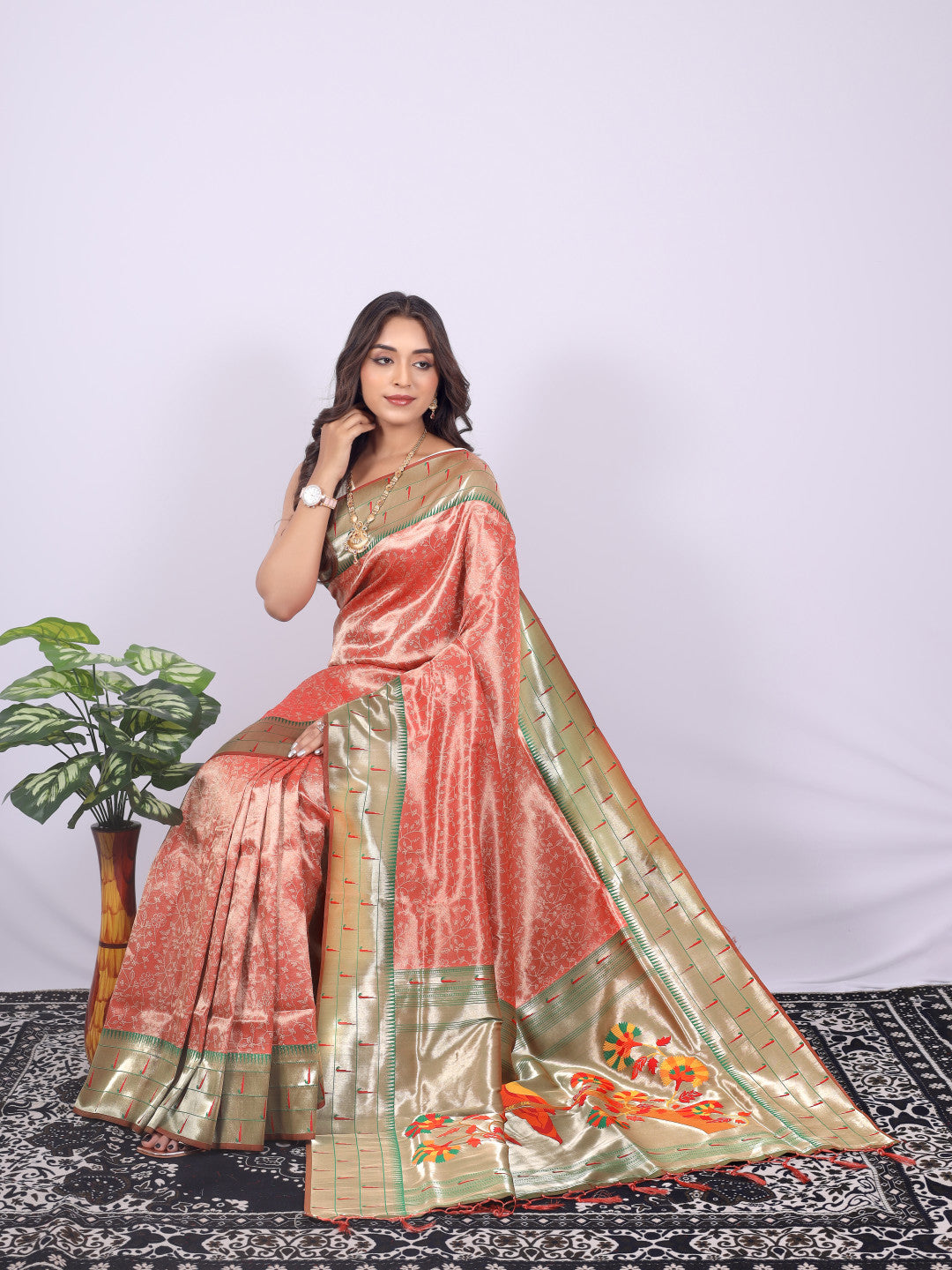 Orange color tissue silk saree with zari weaving work