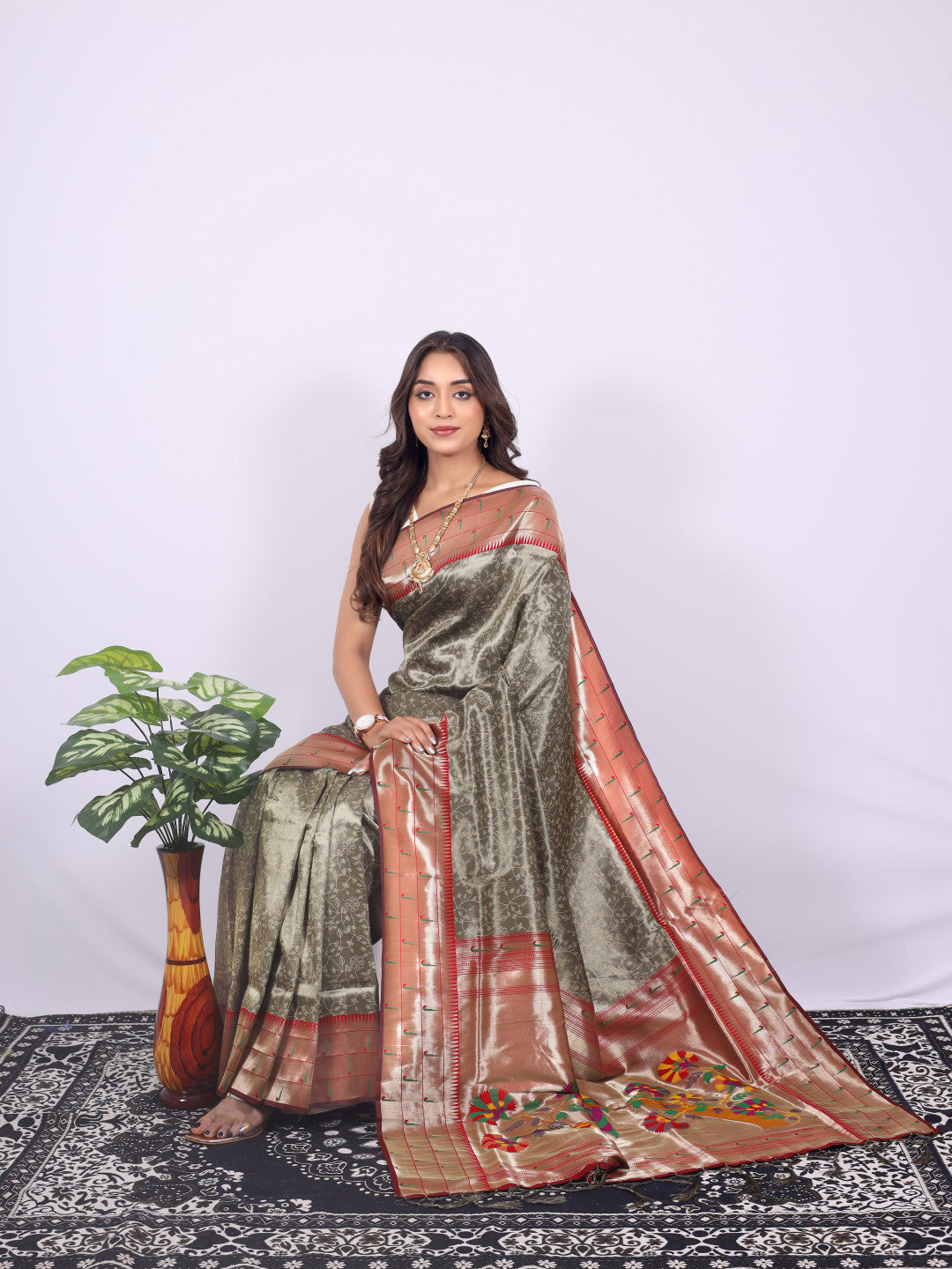 Gray color tissue silk saree with zari weaving work