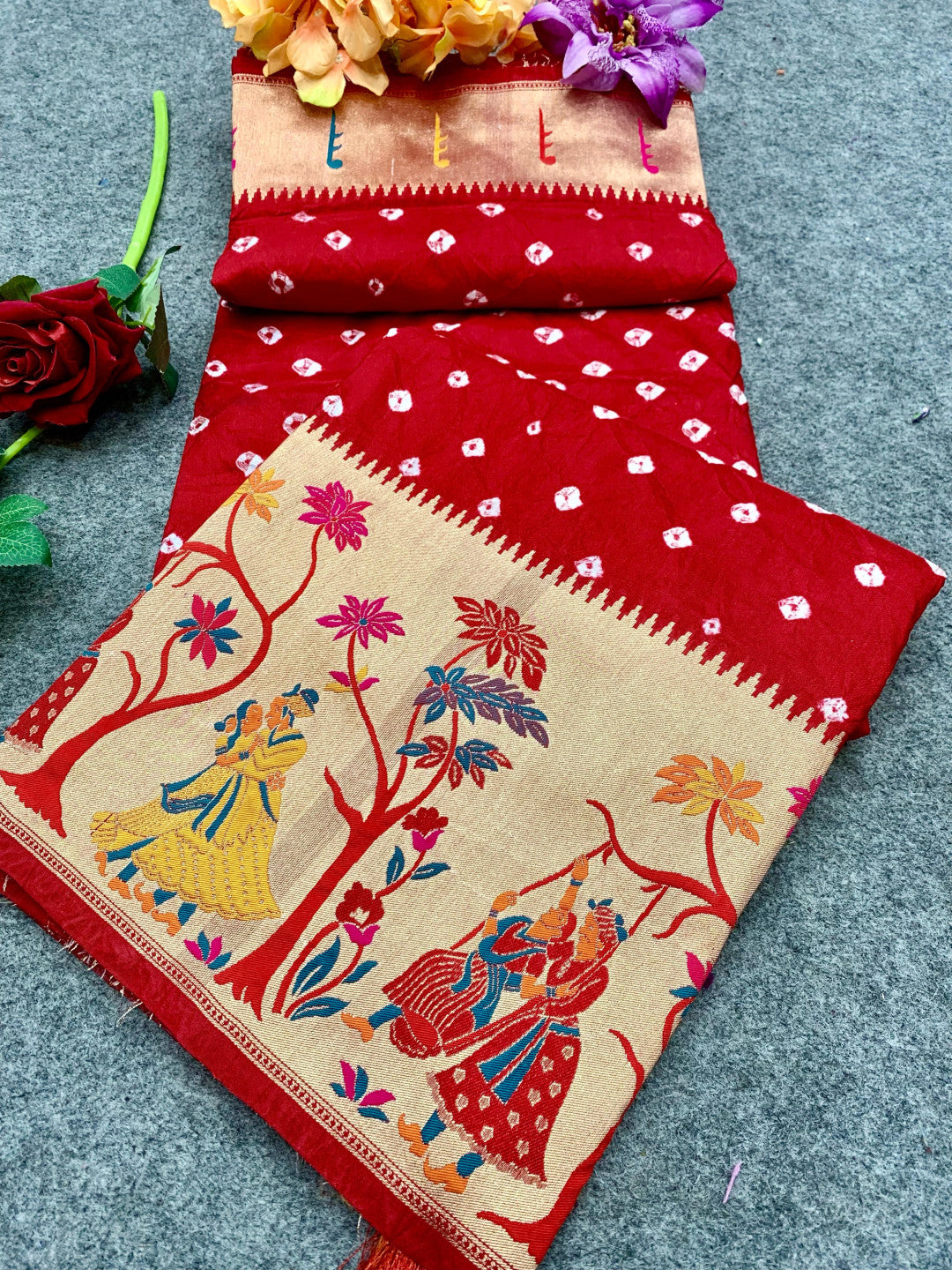 Red color bandhej silk saree with zari weaving work