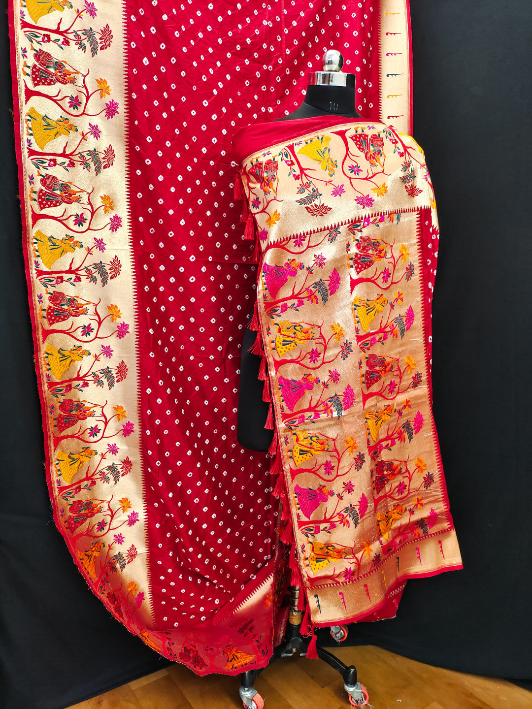 Red color bandhej silk saree with zari weaving work