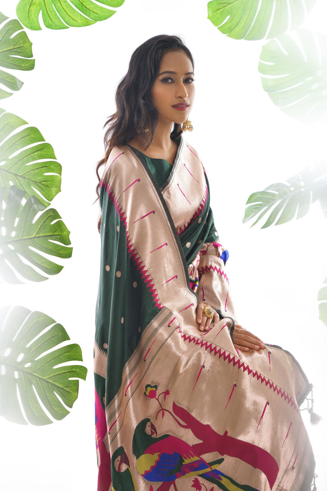 Dark green color paithani silk saree with zari weaving work