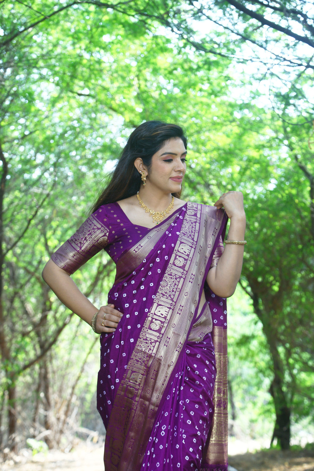 Magenta color bandhej silk saree with zari weaving work