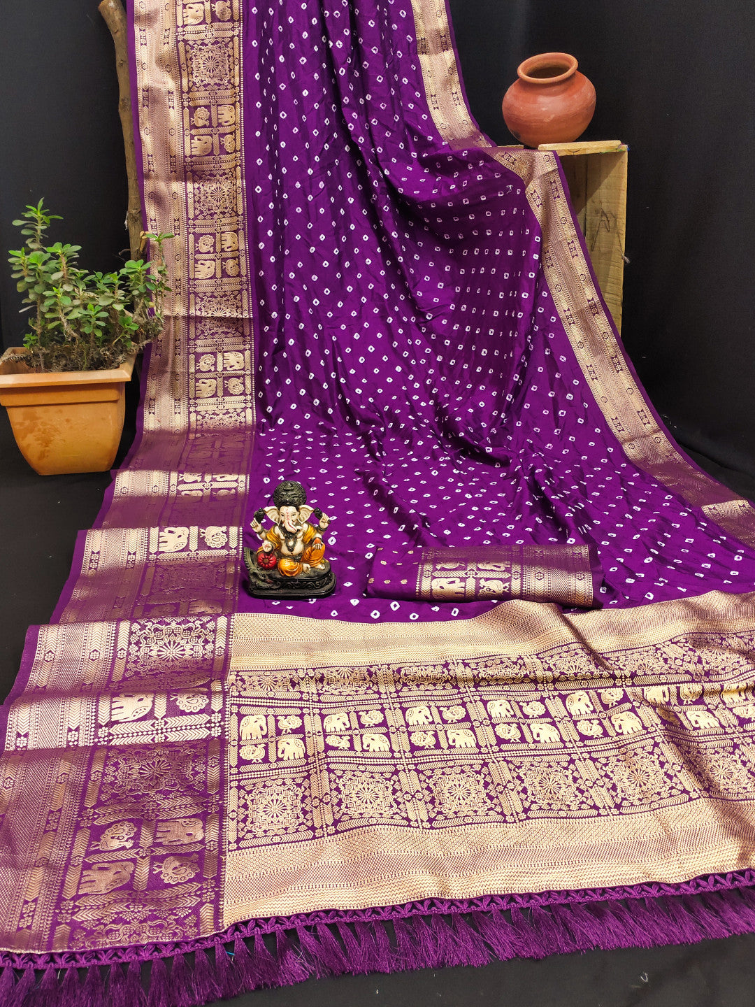 Magenta color bandhej silk saree with zari weaving work