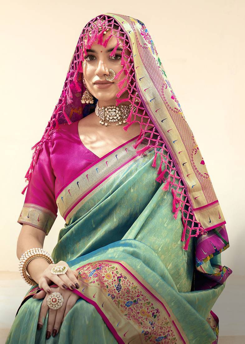 Sea green soft tissue paithani silk saree with zari weaving work