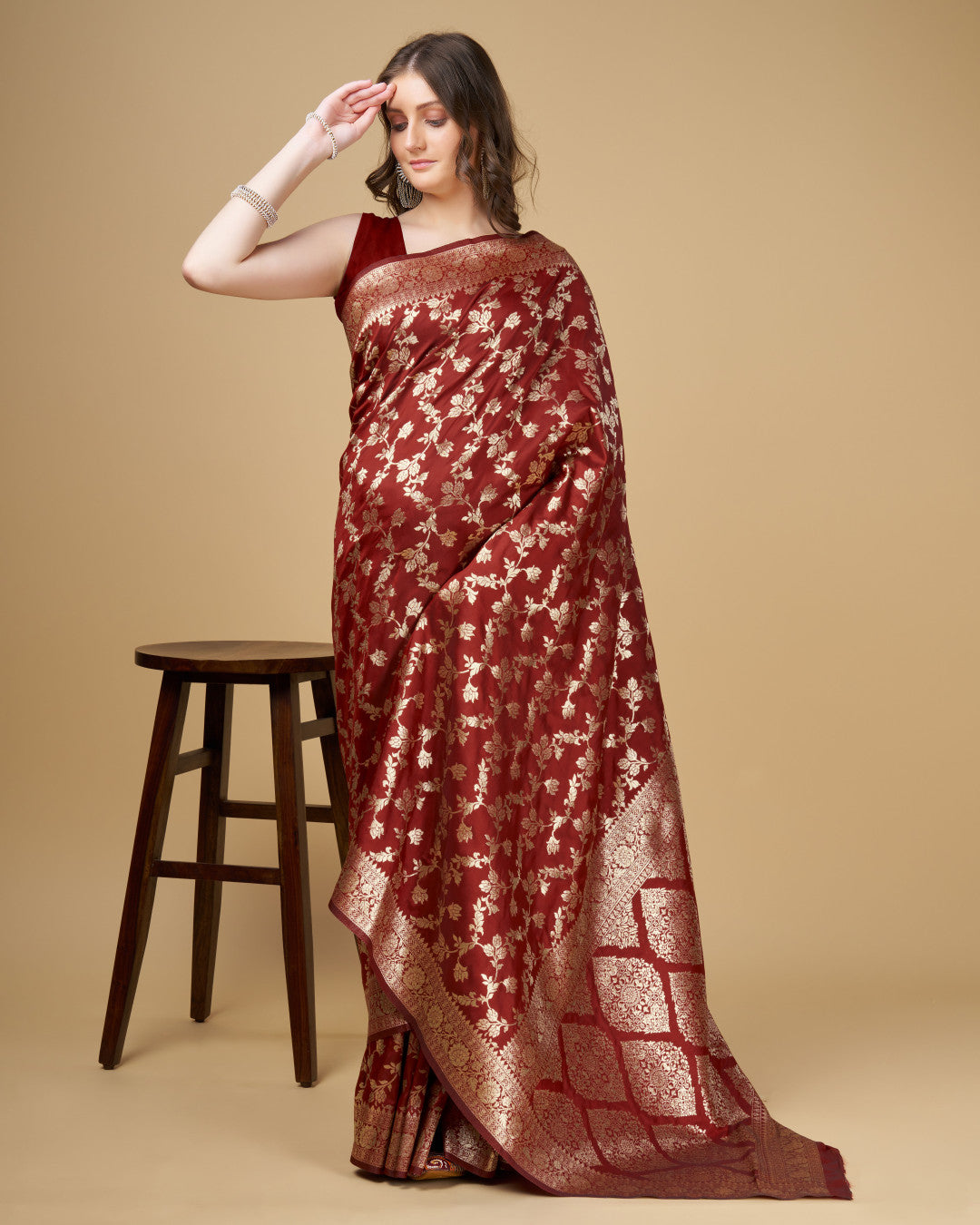 Maroon color pure silk saree with zari weaving work