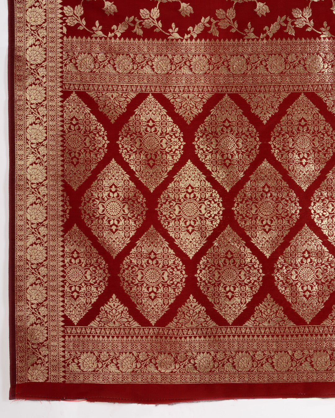 Maroon color pure silk saree with zari weaving work