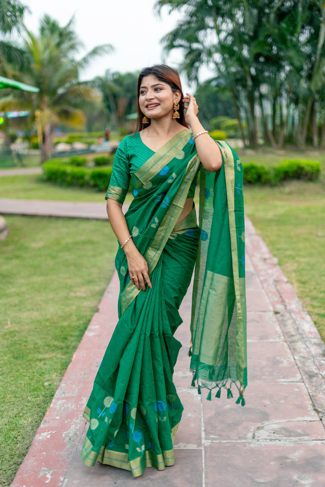 Green color soft linen silk saree with jamdani woven design