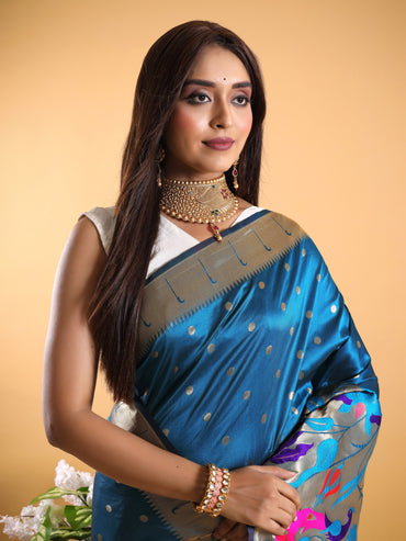 Rama green color paithani silk saree with zari weaving work
