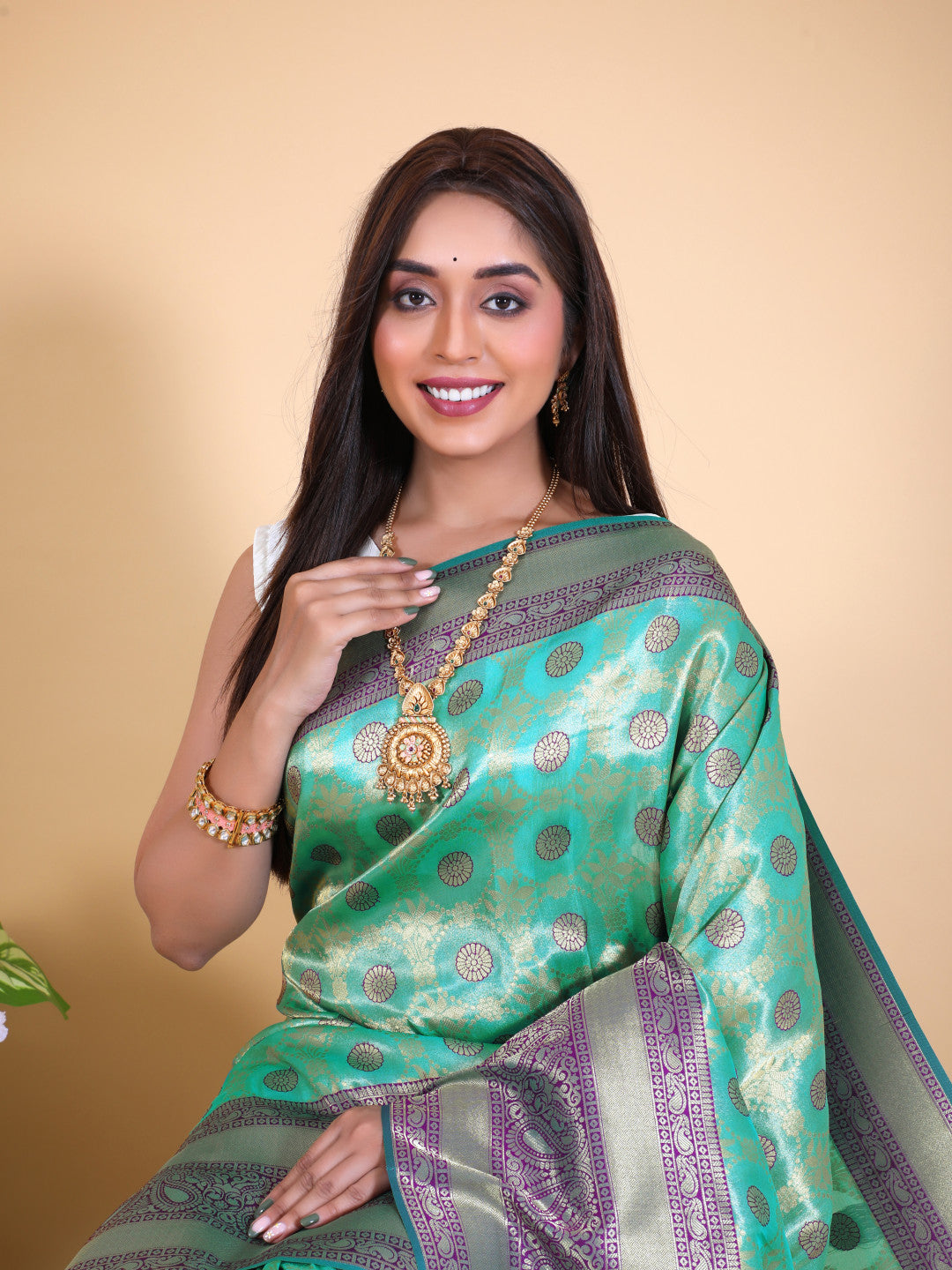 Sea green and purple color tissue silk saree with zari weaving work