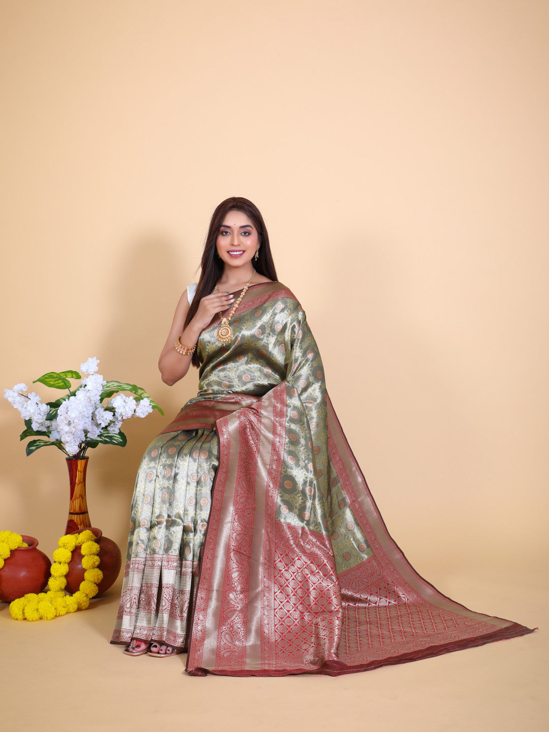 Gray color tissue silk saree with zari weaving work