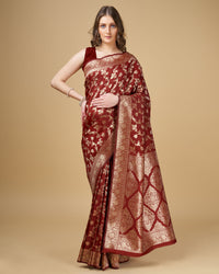 Maroon color pure silk saree with zari weaving work