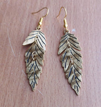 Gold Feather Leaf Brass Dangle Earrings with Detailed Cutout Design